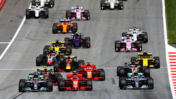 SPIELBERG, AUSTRIA - JULY 01: Lewis Hamilton of Great Britain driving the (44) Mercedes AMG Petronas F1 Team Mercedes WO9, Sebastian Vettel of Germany driving the (5) Scuderia Ferrari SF71H and Valtteri Bottas driving the (77) Mercedes AMG Petronas F1 Team Mercedes WO9 (Photo by Mark Thompson/Getty Images)