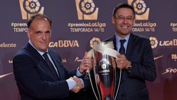 FC Barcelona president Josep Maria Bartomeu (R) receives from LFP's president Javier Tebas the trophy of LFP 2014-2015 season Best First Division Team award. LLUIS GENE/AFP via Getty Images)