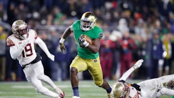 SOUTH BEND, IN - NOVEMBER 10: Dexter Williams #2 of the Notre Dame Fighting Irish breaks a tackle on his way to a 58-yard touchdown run against the Florida State Seminoles in the second quarter of the game at Notre Dame Stadium on November 10, 2018 in South Bend, Indiana. (Photo by Joe Robbins/Getty Images)