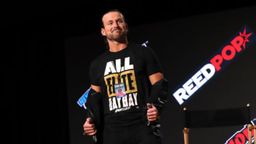 NEW YORK, NEW YORK - OCTOBER 09: Adam Cole appears onstage during the All Elite Wrestling Invades New York Comic Con panel during Day 3 of New York Comic Con 2021 at Jacob Javits Center on October 09, 2021 in New York City. (Photo by Bennett Raglin/Getty Images for ReedPop)