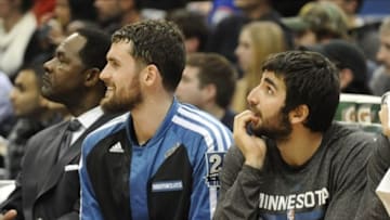 Dec 30, 2013; Minneapolis, MN, USA; Minnesota Timberwolves forward Kevin Love (L) and Minnesota Timberwolves guard Ricky Rubio (R) sit on the bench in the fourth quarter against the Dallas Mavericks at Target Center. The Mavericks won 100-98. Mandatory Credit: Marilyn Indahl-USA TODAY Sports