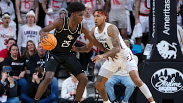 UCF Knights Taylor Hendricks guarded by Cincinnati Bearcats guard Jeremiah Davenport at Fifth Third Arena. Getty Images.