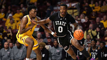 Dec 11, 2022; Minneapolis, Minnesota, USA; Mississippi State Bulldogs forward D.J. Jeffries (0) drives to the basket while Minnesota Golden Gophers forward Joshua Ola-Joseph (1) defends during the second half at Williams Arena. Mandatory Credit: Matt Krohn-USA TODAY Sports