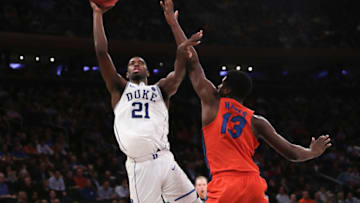 NEW YORK, NY - DECEMBER 06: Amile Jefferson #21 of the Duke Blue Devils puts up a shot against the Florida Gators in the second half during the Jimmy V Classic at Madison Square Garden on December 6, 2016 in New York City. (Photo by Michael Reaves/Getty Images)