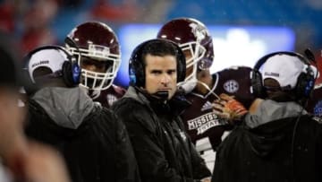 Dec 30, 2015; Charlotte, NC, USA; Mississippi State Bulldogs defensive coordinator Manny Diaz huddles up with the defense during a timeout in the fourth quarter against the North Carolina State Wolfpack in the 2015 Belk Bowl at Bank of America Stadium. The Bulldogs defeated the Wolfpack 51-28. Mandatory Credit: Jeremy Brevard-USA TODAY Sports
