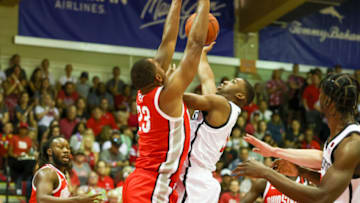 LAHAINA, HI - NOVEMBER 21: Lamont Butler #5 of the San Diego State Aztecs attempts or shoot over Zed Key #23 of the Ohio State Buckeyes in the first half of the game during the Maui Invitational at Lahaina Civic Center on November 21, 2022 in Lahaina, Hawaii. (Photo by Darryl Oumi/Getty Images)