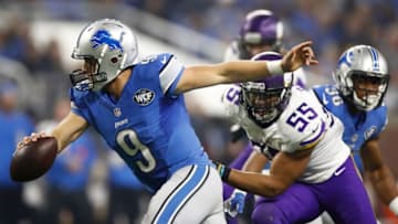DETROIT.MI - NOVEMBER 24: Quarterback Matthew Stafford #9 of the Detroit Lions scrambles away from Anthony Barr (55) of the Minnesota Vikings during third quarter action at Ford Field on November 24, 2016 in Detroit, Michigan. (Photo by Gregory Shamus/Getty Images)