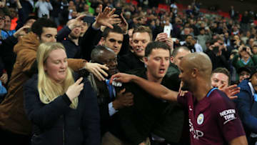 LONDON, ENGLAND - APRIL 14: Vincent Kompany of Manchester City celebrates victory with the Manchester City fans after the Premier League match between Tottenham Hotspur and Manchester City at Wembley Stadium on April 14, 2018 in London, England. (Photo by Victoria Haydn/Man City via Getty Images)