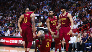 MIAMI, FLORIDA - MARCH 08: Caris LeVert #3 of the Cleveland Cavaliers is helped up by teammates during the fourth quarter of the game against the Miami Heat at Miami-Dade Arena on March 08, 2023 in Miami, Florida. NOTE TO USER: User expressly acknowledges and agrees that, by downloading and or using this photograph, User is consenting to the terms and conditions of the Getty Images License Agreement. (Photo by Megan Briggs/Getty Images)