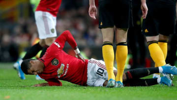 Manchester United's Marcus Rashford lies in pain after picking up a back injury during the FA Cup third round replay match at Old Trafford, Manchester. (Photo by Martin Rickett/PA Images via Getty Images)