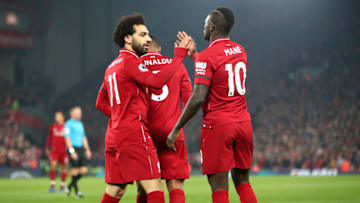 LIVERPOOL, ENGLAND - FEBRUARY 27: Sadio Mane of Liverpool celebrates after scoring his team's first goal with Mohamed Salah of Liverpool during the Premier League match between Liverpool FC and Watford FC at Anfield on February 27, 2019 in Liverpool, United Kingdom. (Photo by Clive Brunskill/Getty Images)
