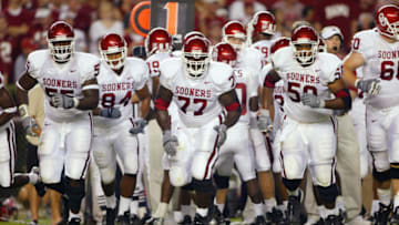 TUSCALOOSA, AL - SEPTEMBER 6: The Oklahoma Sooners offensive line emerges from a huddle against the Alabama Crimson Tide on September 6, 2003 in Tuscaloosa, Alabama. (Photo by Jamie Squire/Getty Images).