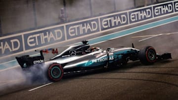 ABU DHABI, UNITED ARAB EMIRATES - NOVEMBER 26: Second place finisher Lewis Hamilton of Great Britain and Mercedes GP celebrates with donuts on track during the Abu Dhabi Formula One Grand Prix at Yas Marina Circuit on November 26, 2017 in Abu Dhabi, United Arab Emirates. (Photo by Mark Thompson/Getty Images)
