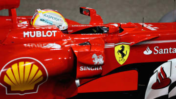 ABU DHABI, UNITED ARAB EMIRATES - NOVEMBER 25: Third place qualifier Sebastian Vettel of Germany and Ferrari stops in parc ferme during qualifying for the Abu Dhabi Formula One Grand Prix at Yas Marina Circuit on November 25, 2017 in Abu Dhabi, United Arab Emirates. (Photo by Mark Thompson/Getty Images)