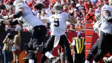 Dec 28, 2014; Tampa, FL, USA; New Orleans Saints quarterback Drew Brees (9) drops back to pass against the Tampa Bay Buccaneers in the first half at Raymond James Stadium. Mandatory Credit: David Manning-USA TODAY Sports