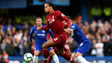 LONDON, ENGLAND - SEPTEMBER 29: Virgil van Dijk of Liverpool controls the ball under pressure from Olivier Giroud of Chelsea during the Premier League match between Chelsea FC and Liverpool FC at Stamford Bridge on September 29, 2018 in London, United Kingdom. (Photo by Shaun Botterill/Getty Images)