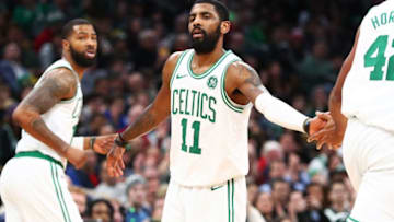 BOSTON, MA - JANUARY 21: Kyrie Irving #11 high fives Marcus Morris #13 and Al Horford #42 of the Boston Celtics during a game against ethics's Miami Heat at TD Garden on January 21, 2019 in Boston, Massachusetts. NOTE TO USER: User expressly acknowledges and agrees that, by downloading and or using this photograph, User is consenting to the terms and conditions of the Getty Images License Agreement. (Photo by Adam Glanzman/Getty Images)