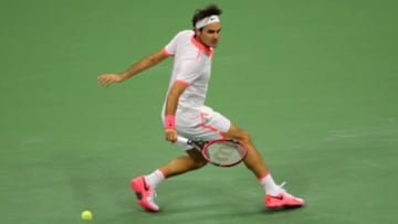 Sep 13, 2015; New York, NY, USA; Roger Federer of Switzerland hits to Novak Djokovic of Serbia on day fourteen of the 2015 U.S. Open tennis tournament at USTA Billie Jean King National Tennis Center. Mandatory Credit: Anthony Gruppuso-USA TODAY Sports