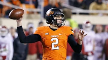 Nov 28, 2015; Stillwater, OK, USA; Oklahoma State Cowboys quarterback Mason Rudolph (2) passes against the Oklahoma Sooners during the second quarter at Boone Pickens Stadium. Mandatory Credit: Alonzo Adams-USA TODAY Sports