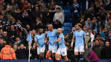MANCHESTER, ENGLAND - MAY 06: Vincent Kompany of Manchester City celebrates after scoring his team's first goal with Raheem Sterling of Manchester City and Sergio Aguero of Manchester City during the Premier League match between Manchester City and Leicester City at Etihad Stadium on May 06, 2019 in Manchester, United Kingdom. (Photo by Laurence Griffiths/Getty Images)