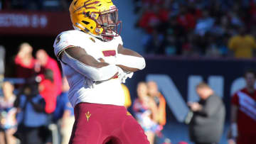 TUCSON, AZ - NOVEMBER 24: Running back Eno Benjamin #3 of the Arizona State Sun Devils strikes a pose in the end zone after scoring a touchdown against the Arizona Wildcats during the second half of the college football game at Arizona Stadium on November 24, 2018 in Tucson, Arizona. (Photo by Ralph Freso/Getty Images)