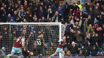 Burnley's Icelandic midfielder Johann Berg Gudmundsson (R) celebrates scoring their first goal to equalise 1-1 during the English Premier League football match between Burnley and Manchester City at Turf Moor in Burnley, north west England on February 3, 2018. / AFP PHOTO / Oli SCARFF / RESTRICTED TO EDITORIAL USE. No use with unauthorized audio, video, data, fixture lists, club/league logos or 'live' services. Online in-match use limited to 75 images, no video emulation. No use in betting, games or single club/league/player publications. / (Photo credit should read OLI SCARFF/AFP/Getty Images)