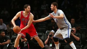 Nov 30, 2014; Brooklyn, NY, USA; Chicago Bulls power forward Pau Gasol (16) dribbles the ball against Brooklyn Nets center Brook Lopez (11) during the third quarter at Barclays Center. Mandatory Credit: Brad Penner-USA TODAY Sports