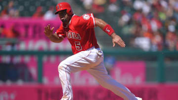 Albert Pujols #5 of the Los Angeles Angels of Anaheim attempts to steal third base during the game against the Kansas City Royals at Angel Stadium of Anaheim on April 12, 2015 in Anaheim, California. (Photo by Josh Barber/Angels Baseball LP/Getty Images)