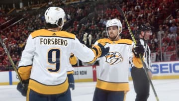 CHICAGO, IL - JANUARY 09: Viktor Arvidsson #33 and Filip Forsberg #9 of the Nashville Predators celebrate after Forsberg scored against the Chicago Blackhawks in the second period at the United Center on January 9, 2019 in Chicago, Illinois. (Photo by Bill Smith/NHLI via Getty Images)