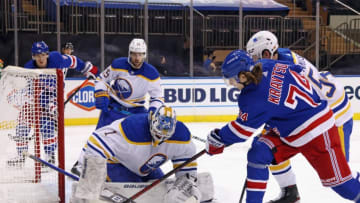 Apr 27, 2021; New York, NY, USA; Ukko-Pekka Luukkonen #1 of the Buffalo Sabres makes the second period save on Vitali Kravtsov #74 of the New York Rangers at Madison Square Garden on April 27, 2021 in New York City. Mandatory Credit: Bruce Bennett/Pool Photo-USA TODAY Sports