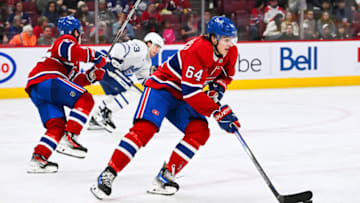 Sep 30, 2023; Montreal, Quebec, CAN; Montreal Canadiens defenseman David Reinbacher (64) plays the puck against the Toronto Maple Leafs during the third period at Bell Centre. Mandatory Credit: David Kirouac-USA TODAY Sports