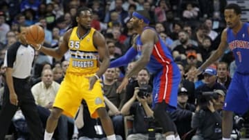 Mar 19, 2014; Denver, CO, USA; Detroit Pistons small forward Josh Smith (6) guards Denver Nuggets small forward Kenneth Faried (35) in the first quarter at the Pepsi Center. Mandatory Credit: Isaiah J. Downing-USA TODAY Sports