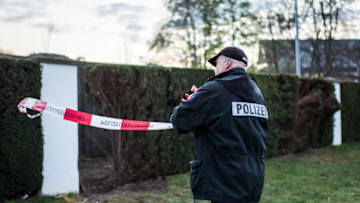 DORTMUND, GERMANY - APRIL 18: Police investigators stand near the replacement of the bus of the Borussia Dortmund football team that was targeted in a bomb attack during a reconstruction of the April 11 event on April 18, 2017 in Dortmund, Germany. Police are still investigating the crime in which three bombs detonated as the bus was pulling away from a nearby hotel, causing two injuries and damage to the bus. Police have discounted initial claims of responsibility by supposed Islamists in letters left at the crime scene as fake. (Photo by Lukas Schulze/Getty Images)