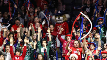 TUCSON, AZ - DECEMBER 13: Fans of the Arizona Wildcats raise their hands to distract the Tigers during the second half of the college basketball game at McKale Center on December 13, 2015 in Tucson, Arizona.(Photo by Nils Nilsen/Getty Images)