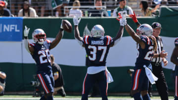 Sep 19, 2021; East Rutherford, New Jersey, USA; New England Patriots running back James White (28) celebrates his rushing touchdown with running back Damien Harris (37) an dcornerback Shaun Wade (26) during the first half against the New York Jets at MetLife Stadium. Mandatory Credit: Vincent Carchietta-USA TODAY Sports