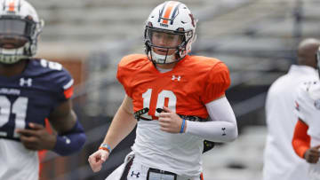 Apr 17, 2021; Auburn, Alabama, USA; Auburn Tigers quarterback Bo Nix (10) takes the field for warmups before the start of the spring game at Jordan-Hare Stadium. Mandatory Credit: John Reed-USA TODAY Sports