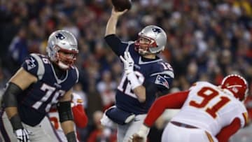 Jan 16, 2016; Foxborough, MA, USA; New England Patriots quarterback Tom Brady (12) throws the ball for a touchdown against the Kansas City Chiefs during the second half in the AFC Divisional round playoff game at Gillette Stadium. Mandatory Credit: David Butler II-USA TODAY Sports
