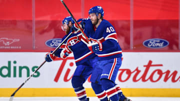 MONTREAL, QC - MARCH 04: Jeff Petry #26 of the Montreal Canadiens and teammate Joel Armia #40 collide during the overtime period against the Winnipeg Jets at the Bell Centre on March 4, 2021 in Montreal, Canada. The Winnipeg Jets defeated the Montreal Canadiens 4-3 in overtime. (Photo by Minas Panagiotakis/Getty Images)