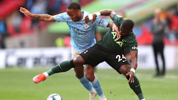 LONDON, ENGLAND - APRIL 25: Raheem Sterling of Manchester City battles for possession with Serge Aurier of Tottenham Hotspur during the Carabao Cup Final between Manchester City and Tottenham Hotspur at Wembley Stadium on April 25, 2021 in London, England. 8,000 fans are due to watch the game at Wembley, the most at an outdoor sporting event in the UK since the coronavirus pandemic started in March, 2020. Each team has been given an allocation of 2,000 with the remaining tickets split between local residents and NHS staff. (Photo by Clive Rose/Getty Images)