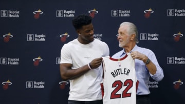 MIAMI, FLORIDA - SEPTEMBER 27: Jimmy Butler #22 of the Miami Heat poses for a photo with president Pat Riley during his introductory press conference at American Airlines Arena on September 27, 2019 in Miami, Florida. NOTE TO USER: User expressly acknowledges and agrees that, by downloading and or using this photograph, User is consenting to the terms and conditions of the Getty Images License Agreement. (Photo by Michael Reaves/Getty Images)