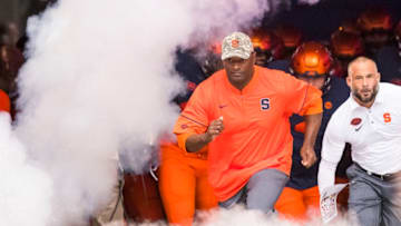 SYRACUSE, NY - SEPTEMBER 09: Head coach Dino Babers of the Syracuse Orange leads his team onto the field before the game against the Middle Tennessee Blue Raiders on September 9, 2017 at The Carrier Dome in Syracuse, New York. (Photo by Brett Carlsen/Getty Images)