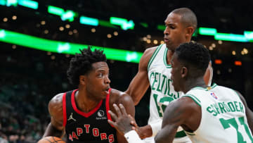 Nov 10, 2021; Boston, Massachusetts, USA; Toronto Raptors forward OG Anunoby (3) looks for an opening against Boston Celtics guard Dennis Schroder (71) and center Al Horford (42) in the first quarter at TD Garden. Mandatory Credit: David Butler II-USA TODAY Sports