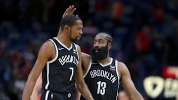 Nov 12, 2021; New Orleans, Louisiana, USA; Brooklyn Nets forward Kevin Durant (7) and guard James Harden (13) talk during the second half against the New Orleans Pelicans at the Smoothie King Center. Mandatory Credit: Chuck Cook-USA TODAY Sports