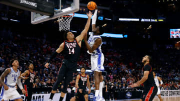 SAN FRANCISCO, CA - MARCH 24: Mark Williams #15 of the Duke Blue Devils goes up for a dunk against Marcus Santos-Silva #14 of the Texas Tech Red Raiders in the second half during the Sweet Sixteen round of the 2022 NCAA Men's Basketball Tournament at Chase Center on March 24, 2022 in San Francisco, California. (Photo by Lance King/Getty Images)