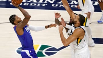 Jan 1, 2021; Salt Lake City, Utah, USA; LA Clippers guard Paul George (13) looks to shoot against Utah Jazz center Rudy Gobert (27) in the first quarter at Vivint Smart Home Arena. Mandatory Credit: Jeffrey Swinger-USA TODAY Sports