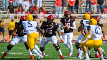 LUBBOCK, TX - SEPTEMBER 29: Alan Bowman #10 of the Texas Tech Red Raiders passes the ball during the first half of the game against the West Virginia Mountaineers on September 29, 2018 at Jones AT&T Stadium in Lubbock, Texas. (Photo by John Weast/Getty Images)