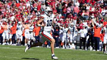 FAYETTEVILLE, ARKANSAS - OCTOBER 16: Bo Nix #10 of the Auburn Tigers runs the ball in for a touchdown in the second half during a game against the Arkansas Razorbacks at Donald W. Reynolds Razorback Stadium on October 16, 2021 in Fayetteville, Arkansas. The Tigers defeated the Razorbacks 38-23. (Photo by Wesley Hitt/Getty Images)