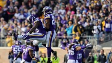 Minnesota Vikings cornerback Xavier Rhodes (29) celebrates with cornerback Shaun Prater (27) during the fourth quarter against the Washington Redskins at TCF Bank Stadium. The Vikings defeated the Redskins 29-26. Mandatory Credit: Brace Hemmelgarn-USA TODAY Sports