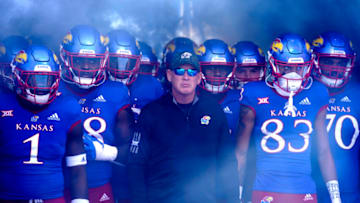 LAWRENCE, KS - NOVEMBER 05: Head coach Lance Leipold of the Kansas Jayhawks stands with his team as they wait to take to the field prior to a game against the Oklahoma State Cowboys at David Booth Kansas Memorial Stadium on November 5, 2022 in Lawrence, Kansas. (Photo by Ed Zurga/Getty Images)