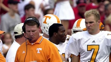 Tennessee offensive coach Randy Sanders looks over his call list with Casey Clausen waiting on the decision during the Georgia game in 2002. Oct. 12, 20021012utgeorgia Mp